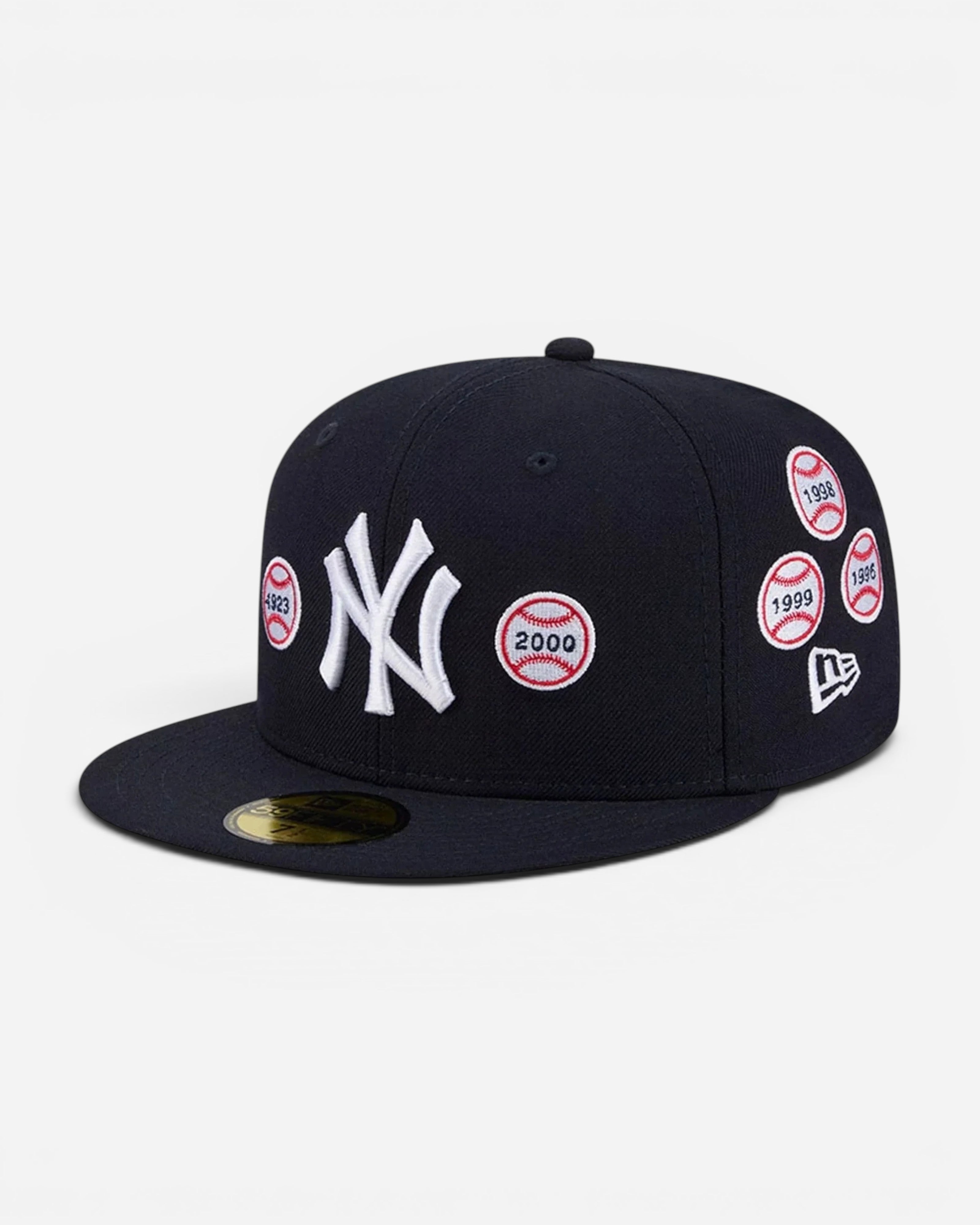Astrofat navy blue New York Yankees 59FIFTY wool fitted cap with embroidered World Series patches and flat visor.