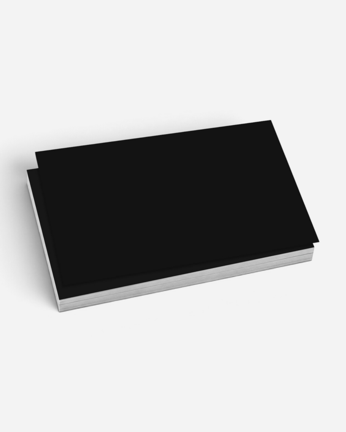 A stack of 50 Astrofat Nice Slaps medium black blank stickers with a smooth semi-gloss finish for tagging.