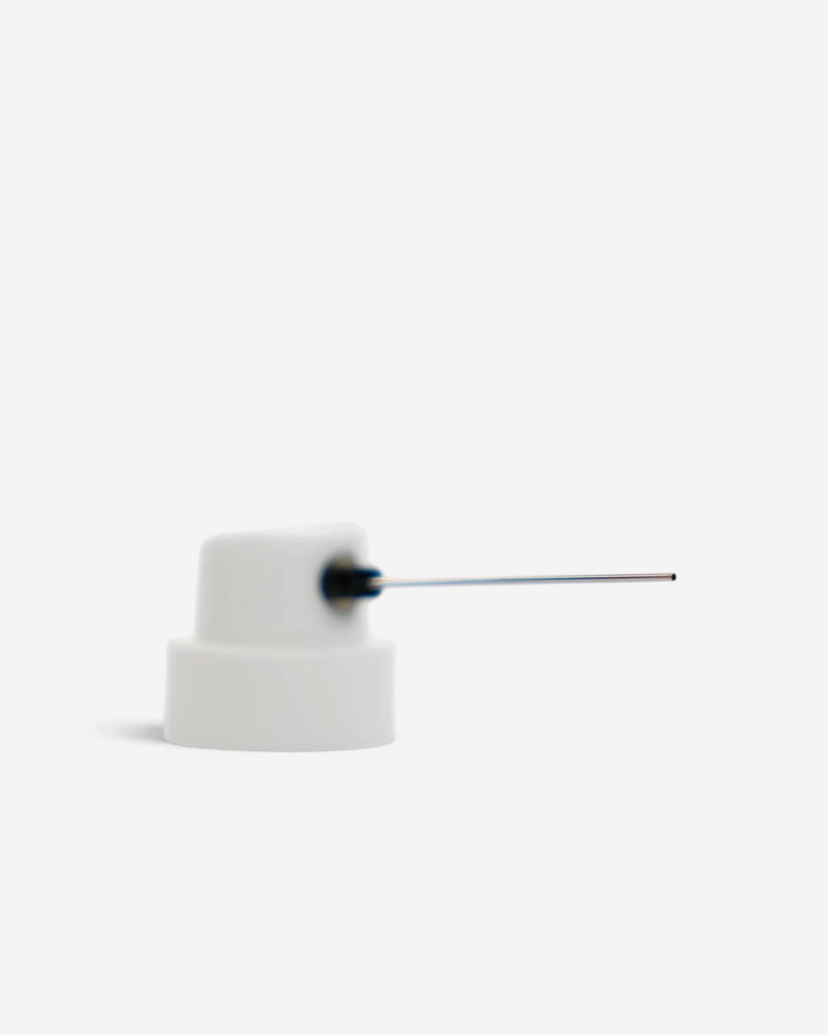 Astrofat Night Quill male needle cap for spray paint cans, featuring a white nozzle with a precision metal needle.