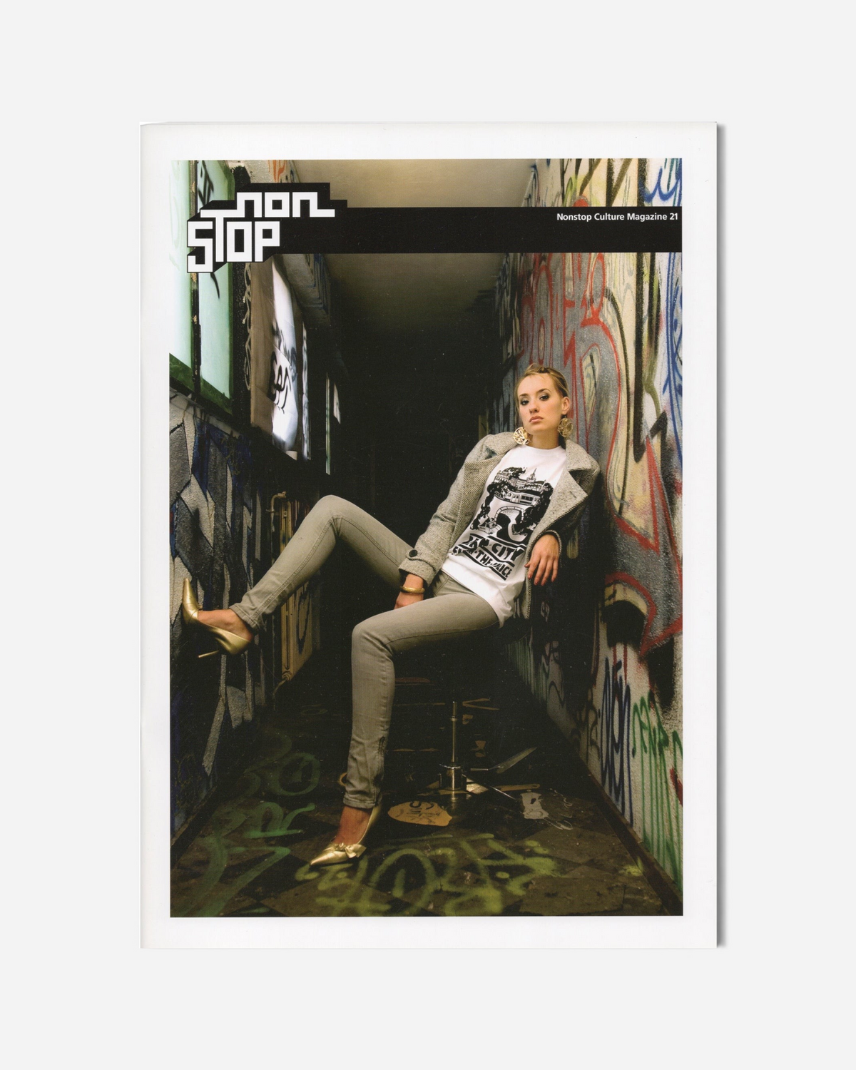 Astrofat Non Stop Magazine Issue 21 featuring a woman in a graffiti-covered corridor on the cover