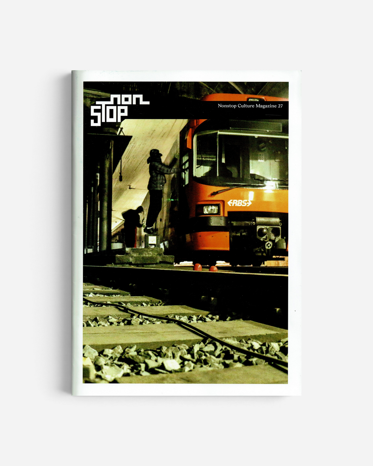Astrofat Non Stop Magazine Issue 27 featuring a graffiti artist painting an orange train in a tunnel.