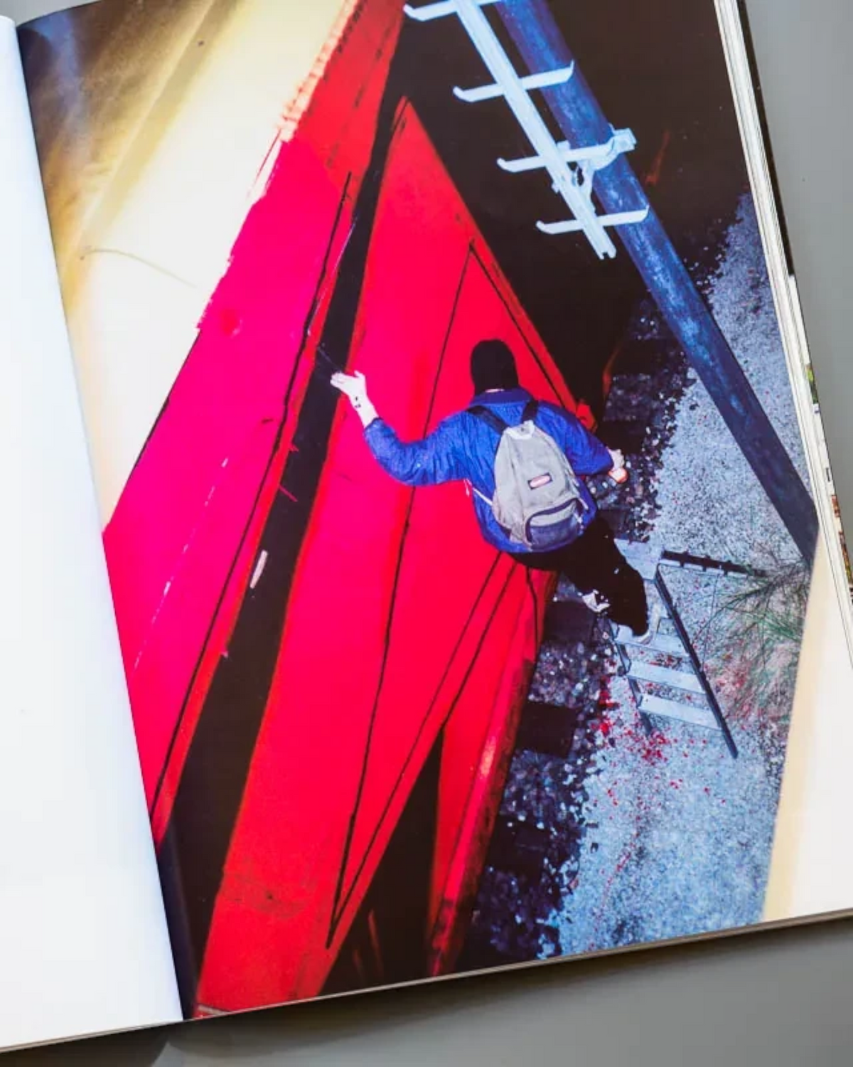 Astrofat Nonstop Magazine issue 27 open page showing a graffiti writer on a red train and German text documentation