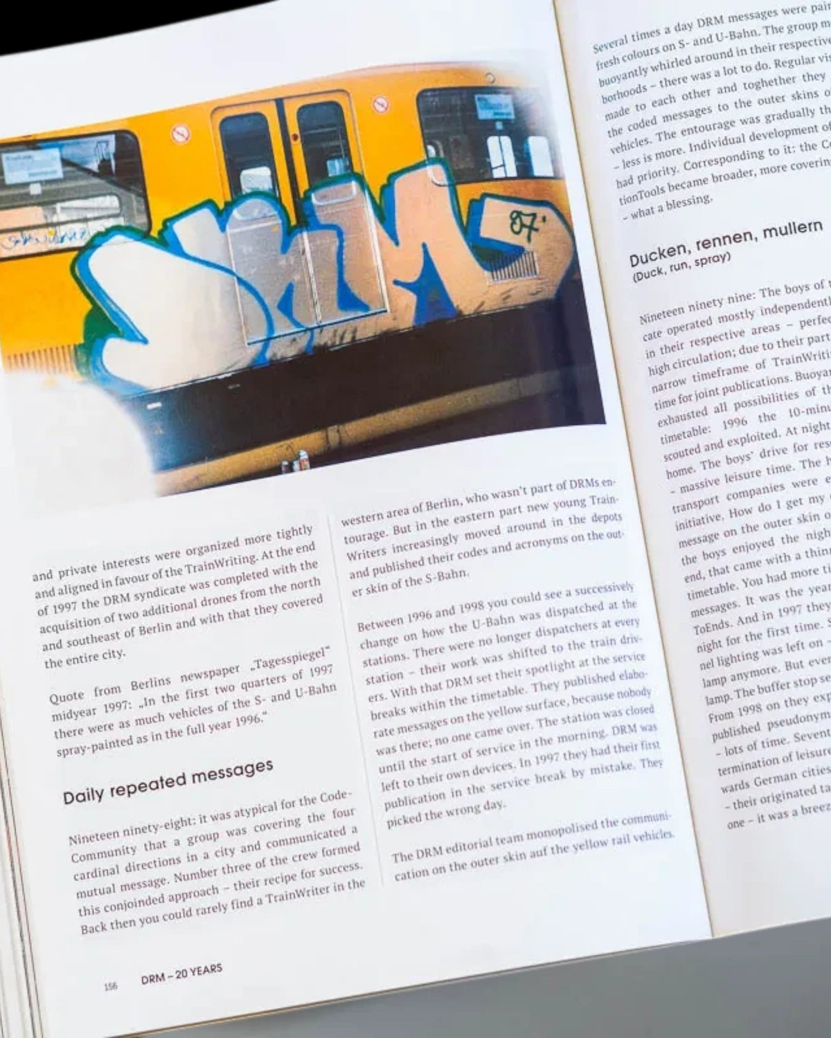 Astrofat Nonstop Magazine issue 27 open to a page featuring graffiti art on a train with accompanying text in German.