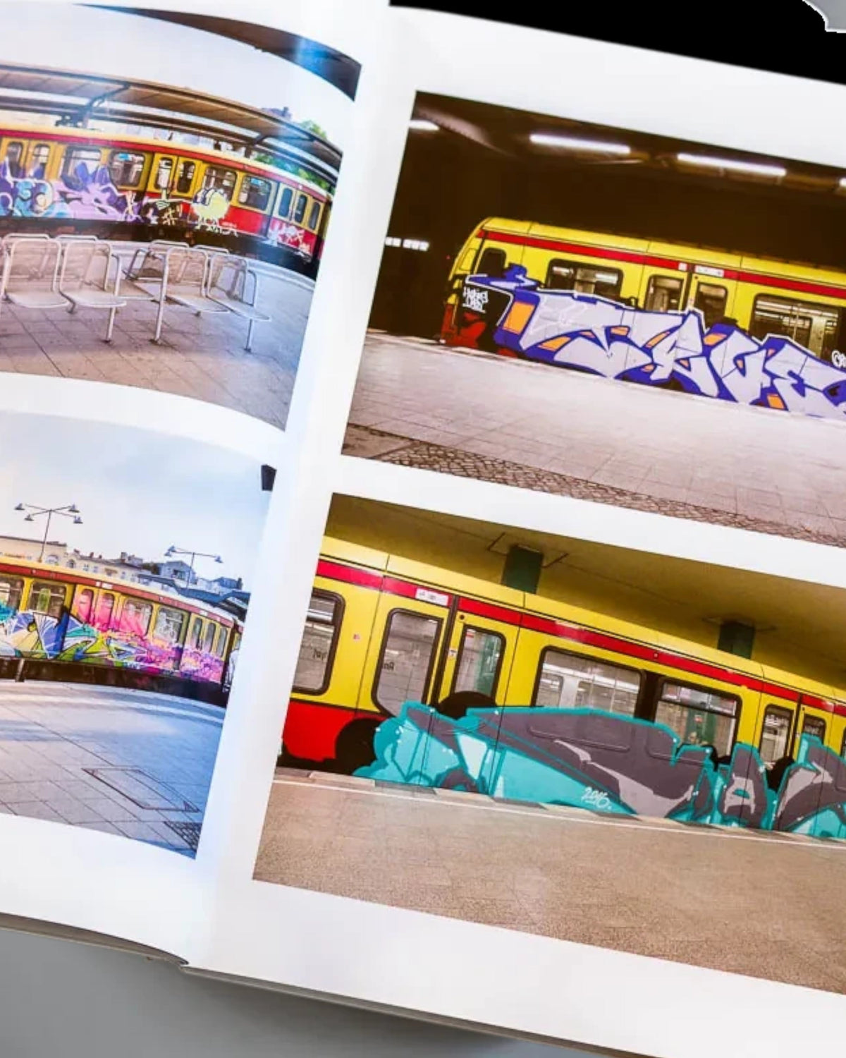 Astrofat Nonstop Magazine issue 27 open pages showing colorful graffiti art on Swiss S-Bahn trains