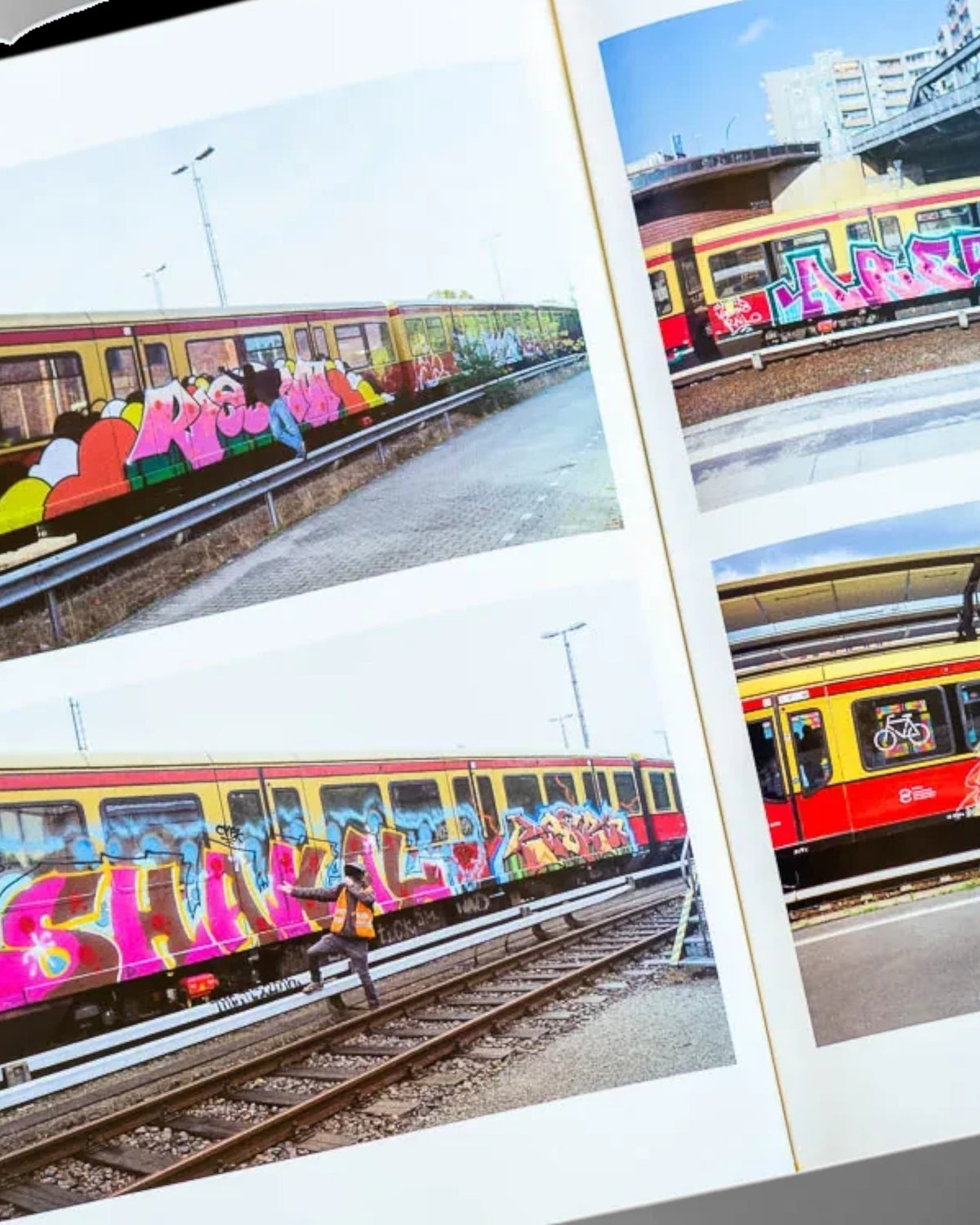 Astrofat Nonstop Magazine issue 27 open to a page showing colorful graffiti art on Swiss trains