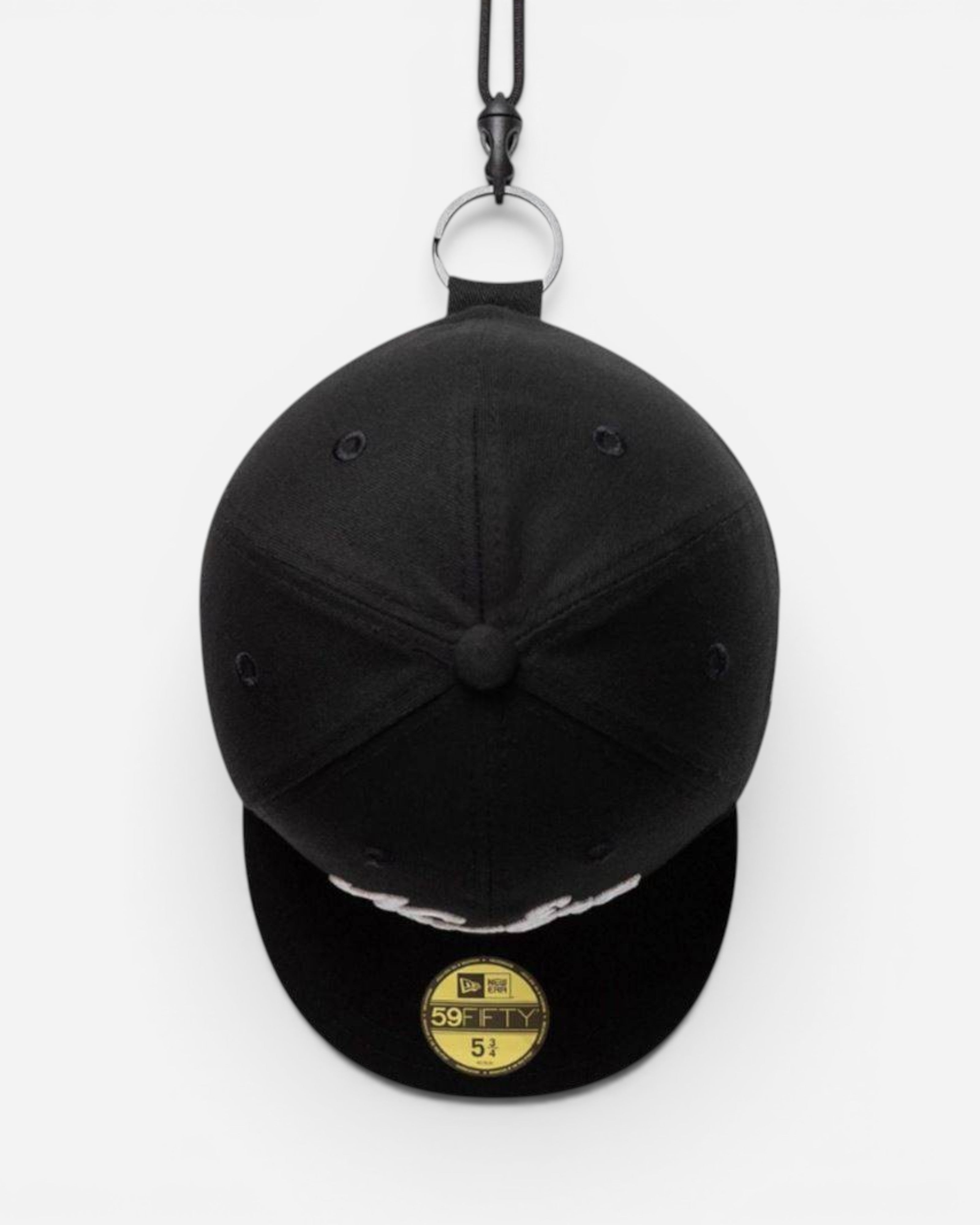 Astrofat black NY Yankees MLB mini cap keychain made of polyester with a metal ring and embroidered team logo.