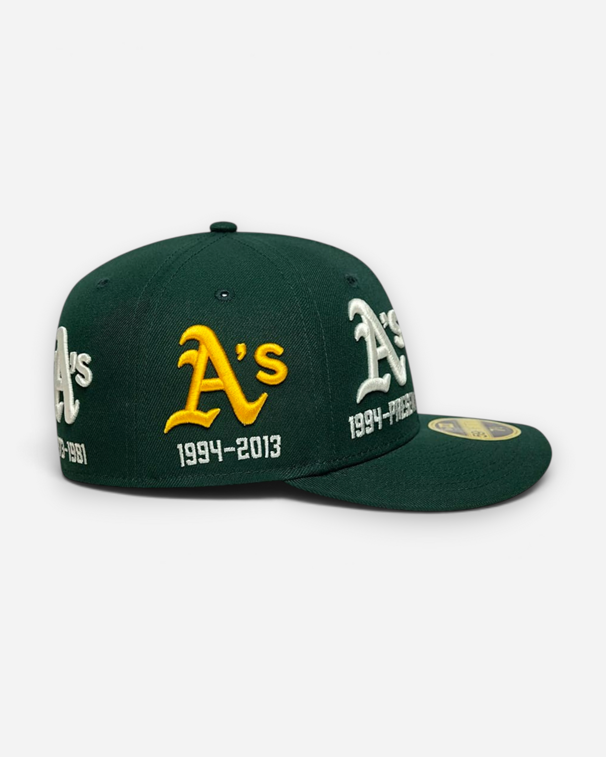 Astrofat Oakland Athletics 59FIFTY low profile fitted cap in dark green with yellow historic team logos and dates.