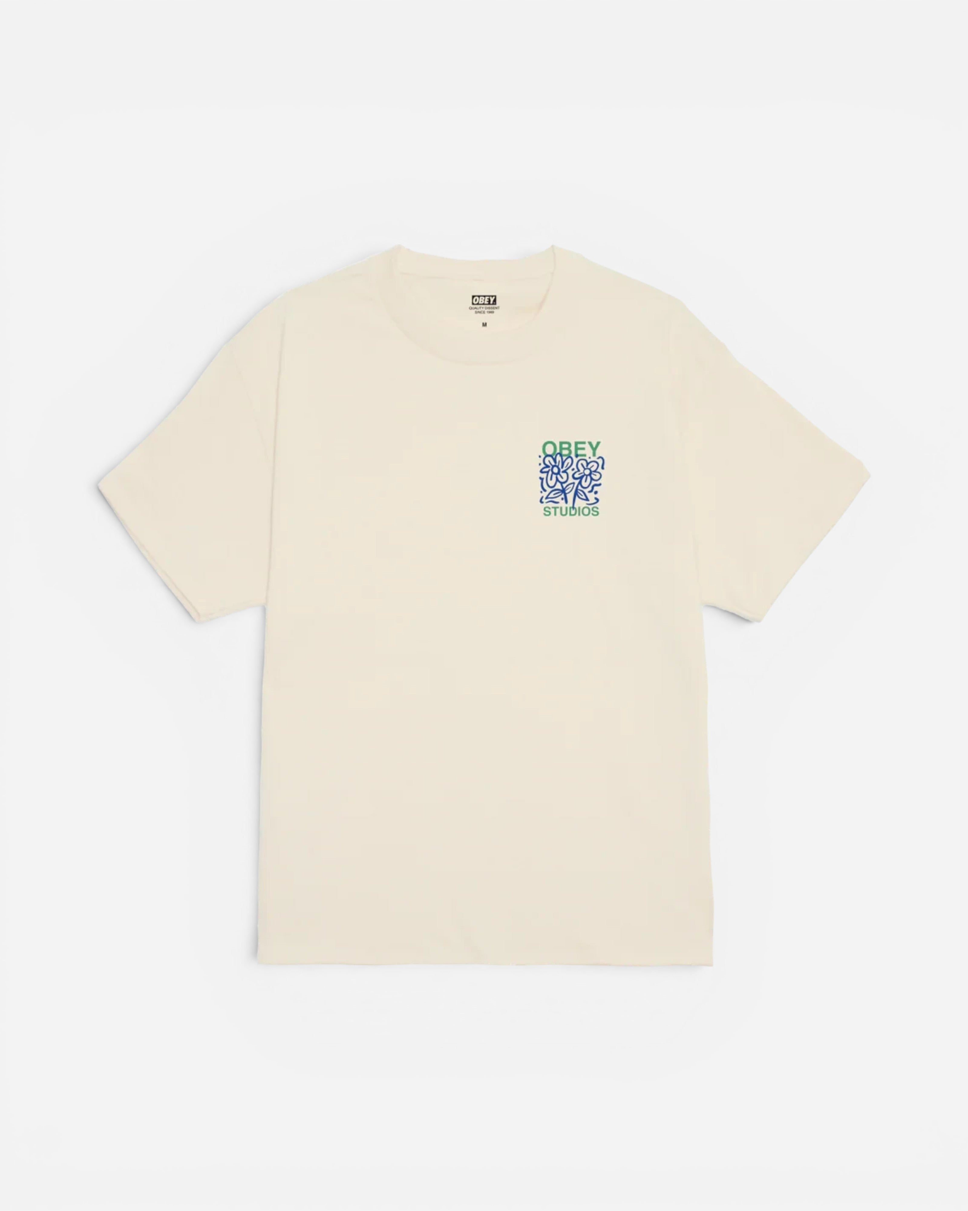 Astrofat Obey cream cotton t-shirt with small blue and green floral graphic on the front chest.