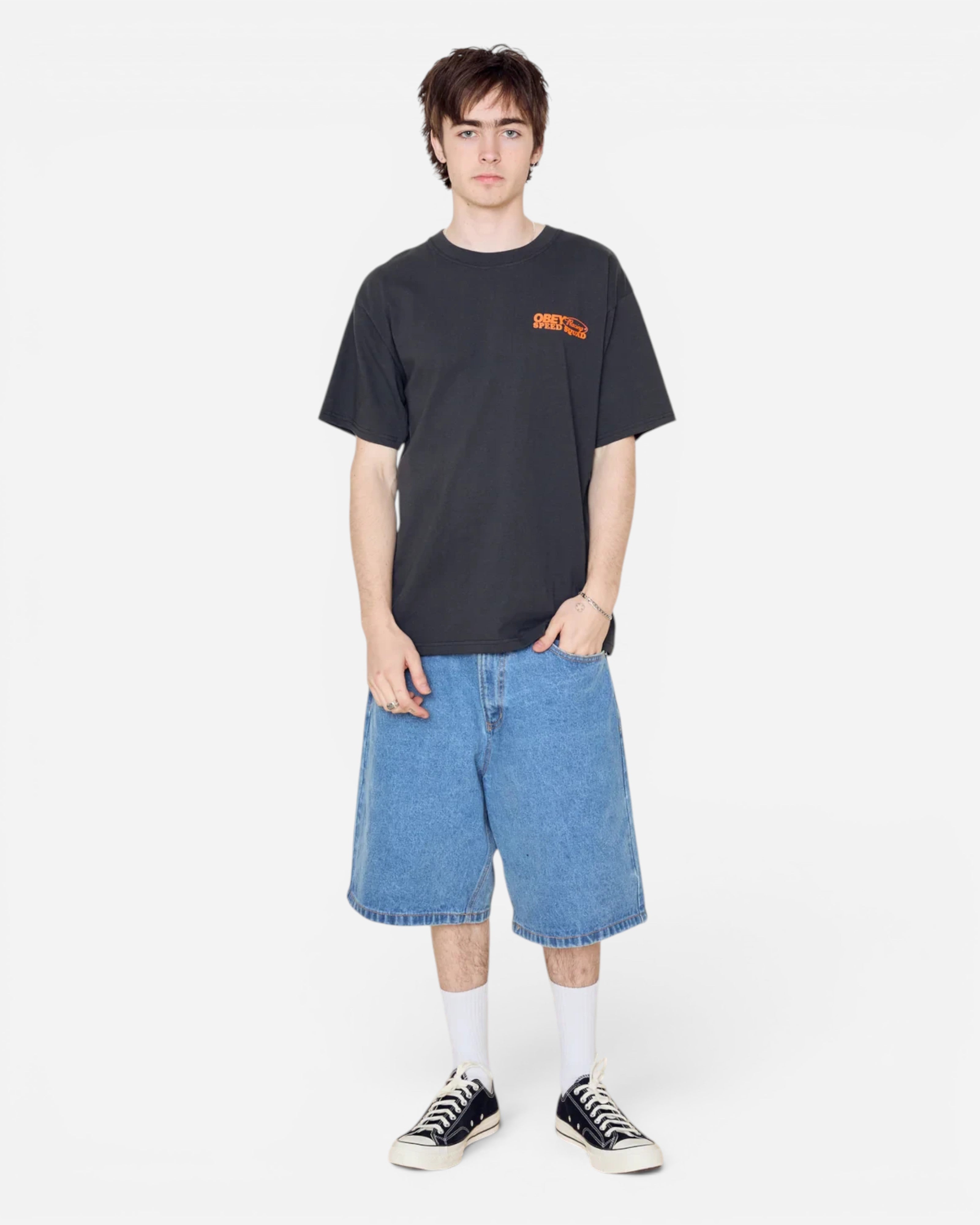 Astrofat model wearing an Obey Speed Squad heavyweight vintage black cotton t-shirt with orange front graphic