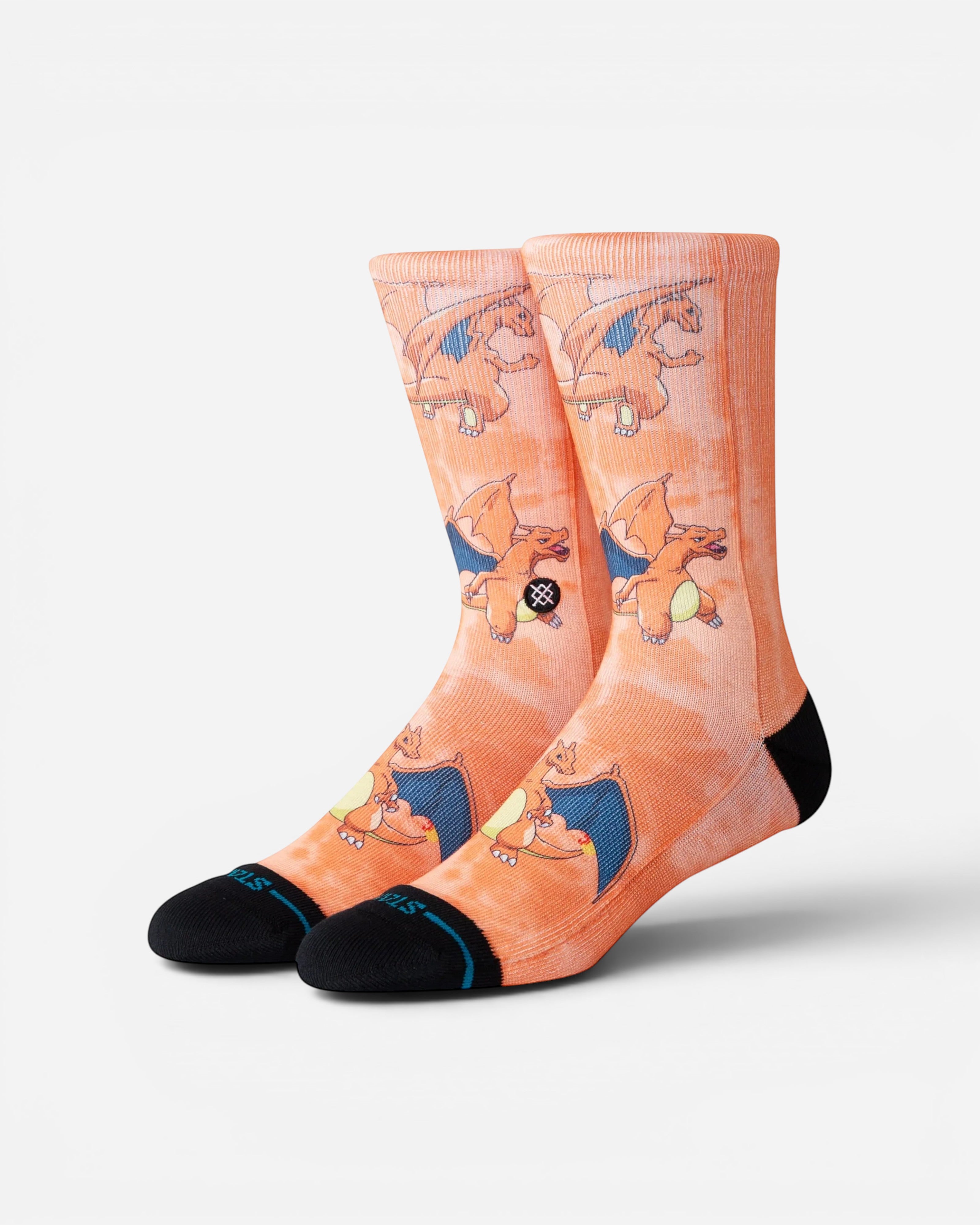 Astrofat Pokemon Charizard crew socks in orange with an all-over print, featuring black toe and heel details.