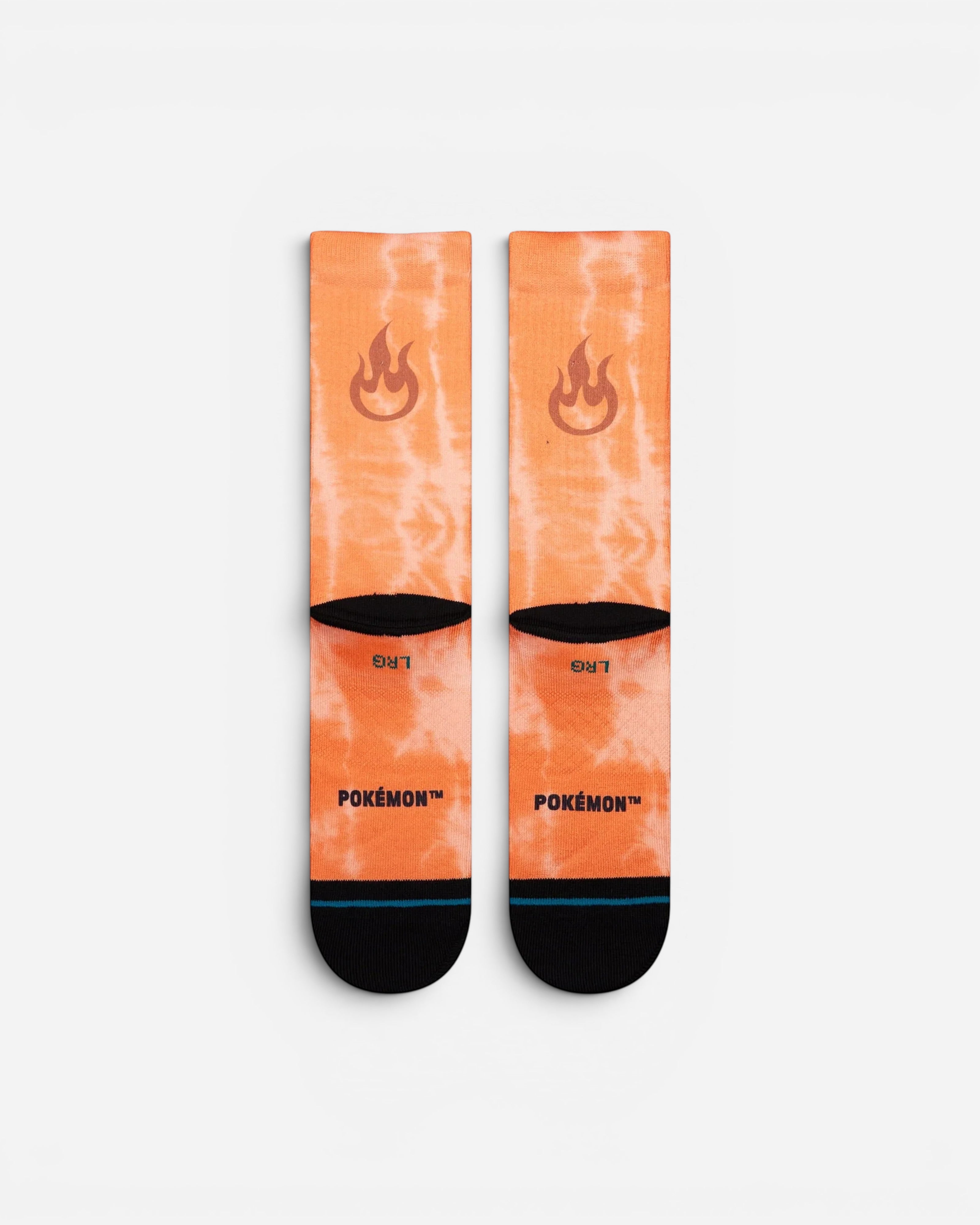 Astrofat Pokemon Charizard crew socks in orange tie-dye with flame icons and black toe and heel details.