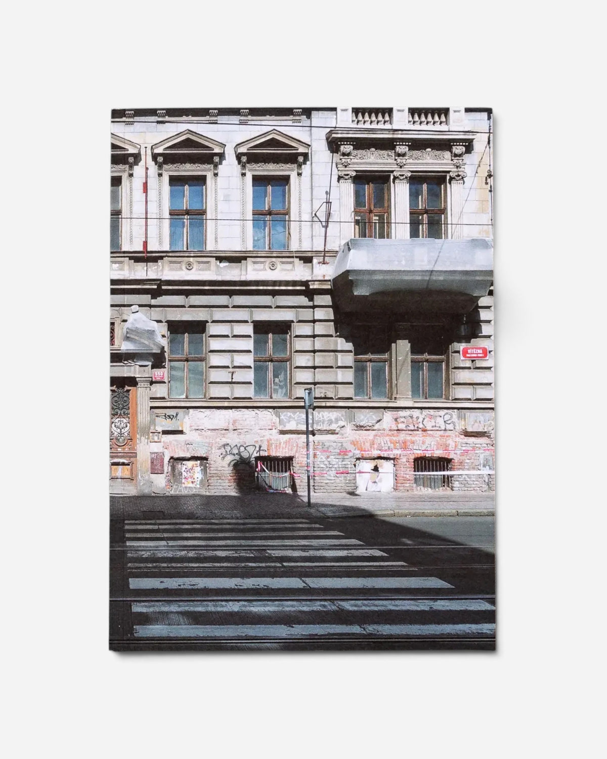 Astrofat Praha Tourist Information zine featuring a photograph of a historic Prague building covered in graffiti tags.