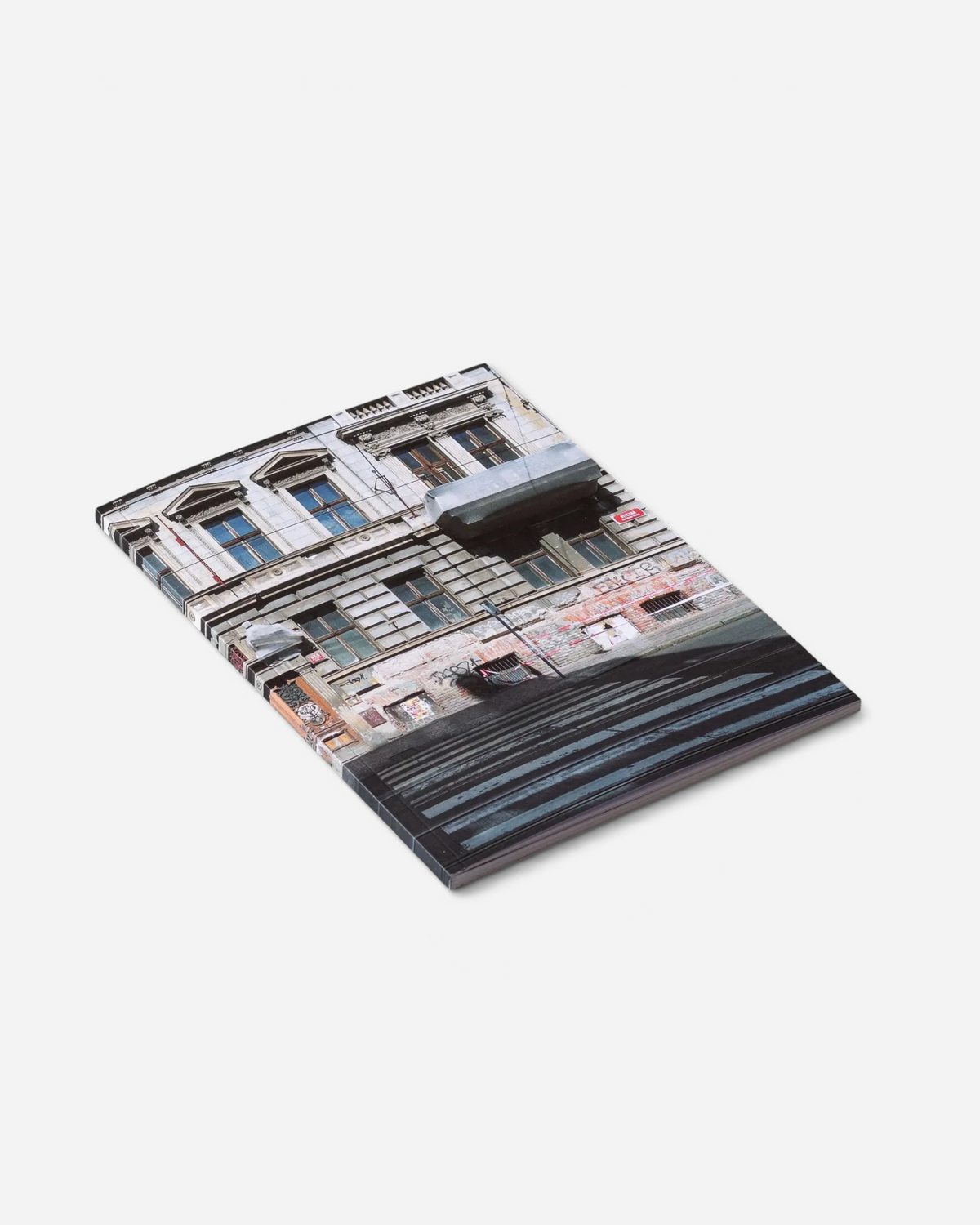 Astrofat Praha Tourist Information zine featuring a cover photo of a Prague building facade covered in street graffiti.