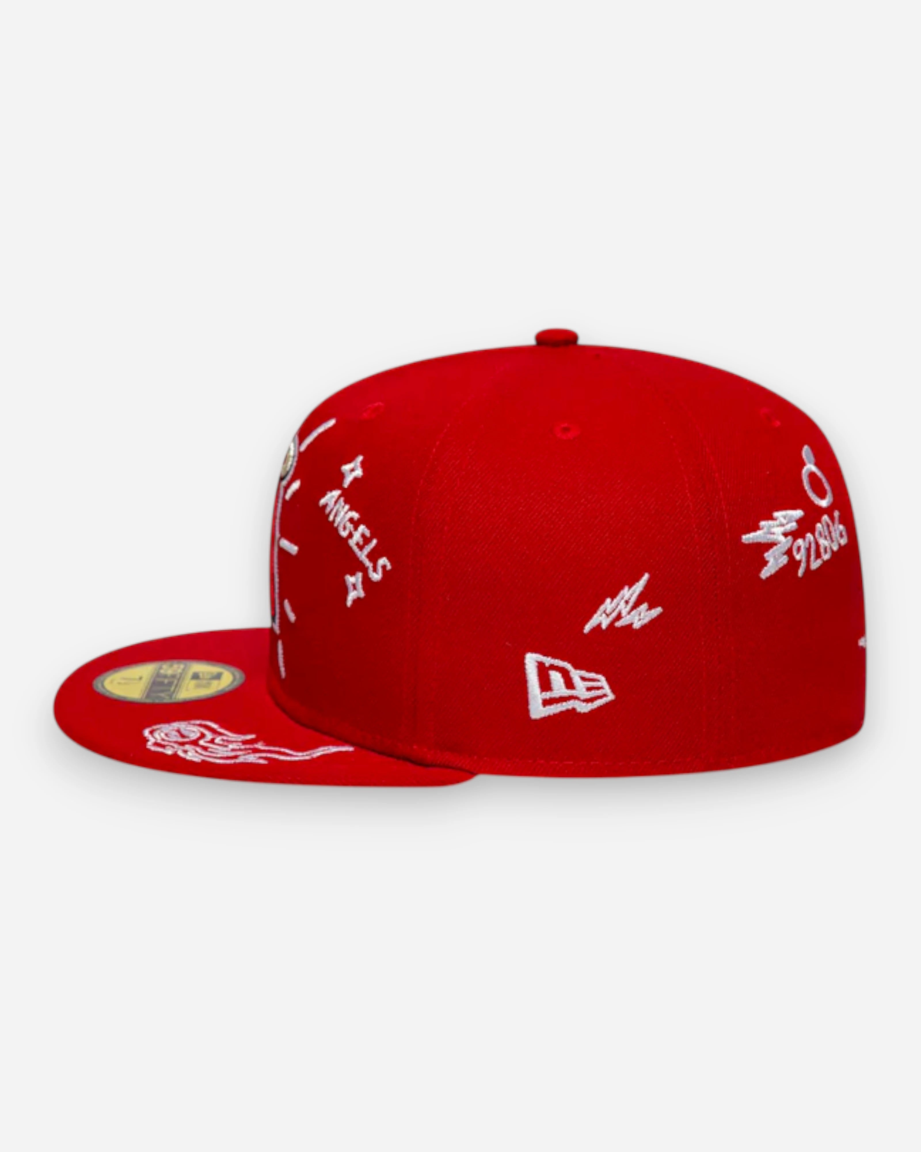 Astrofat red 59FIFTY fitted LA Angels MLB cap with white scribble details and flat brim.