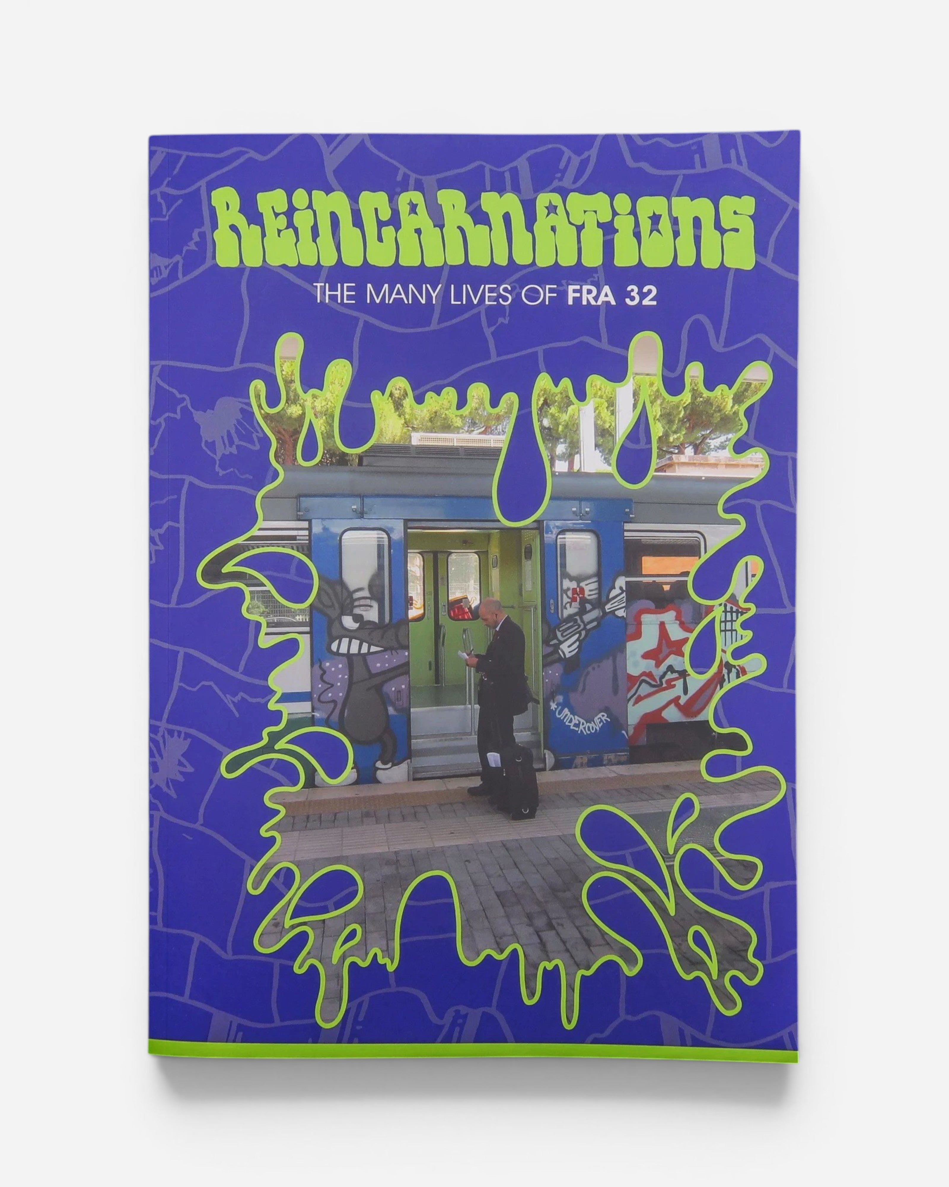 Astrofat Reincarnations The Many Lives of FRA32 paperback book with a purple and neon green graffiti-style cover.