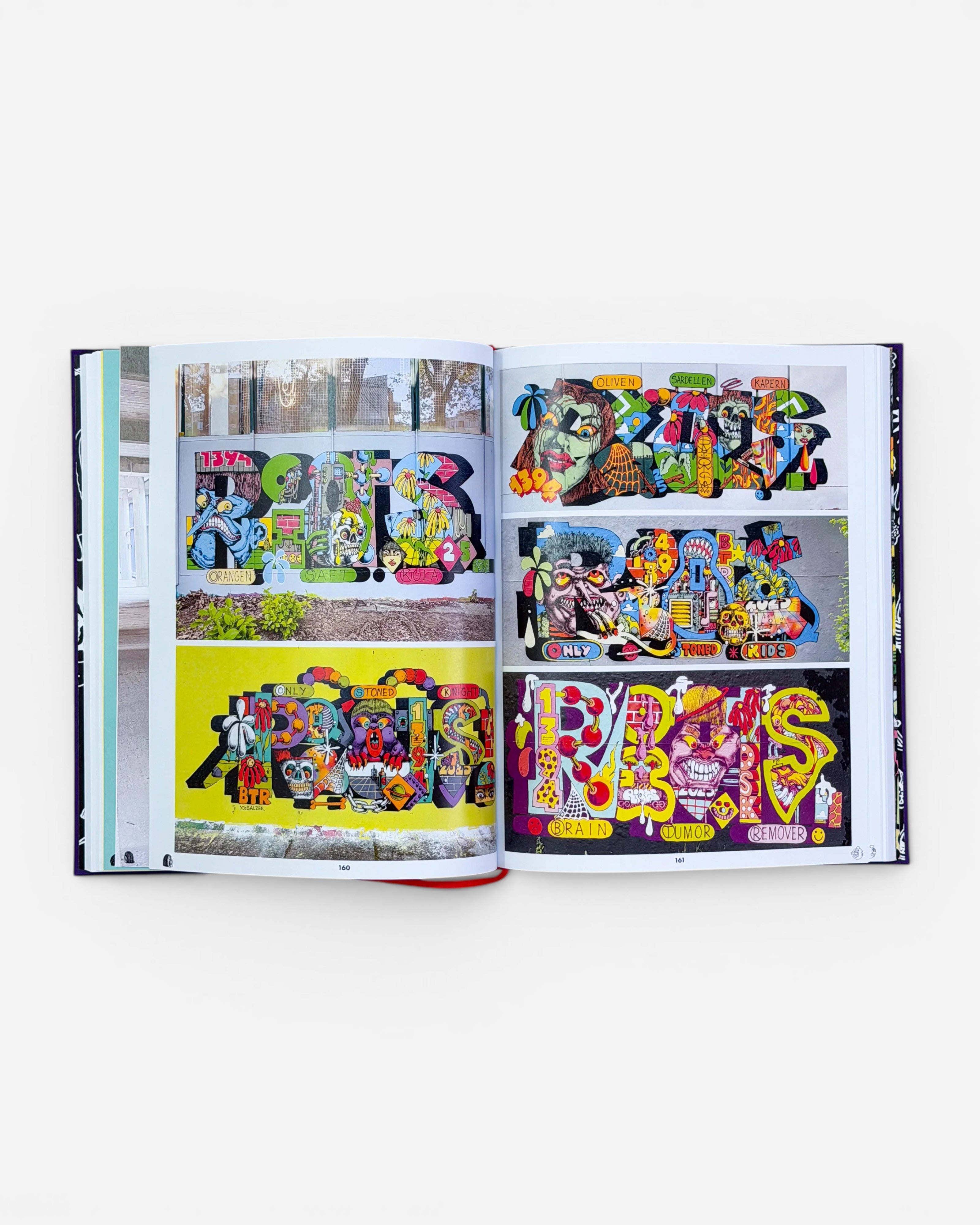 Astrofat RIOT1394 Ultraworld book open to pages 160-161, showcasing vibrant graffiti art, murals, and illustrations with bold lettering and cartoonish characters.