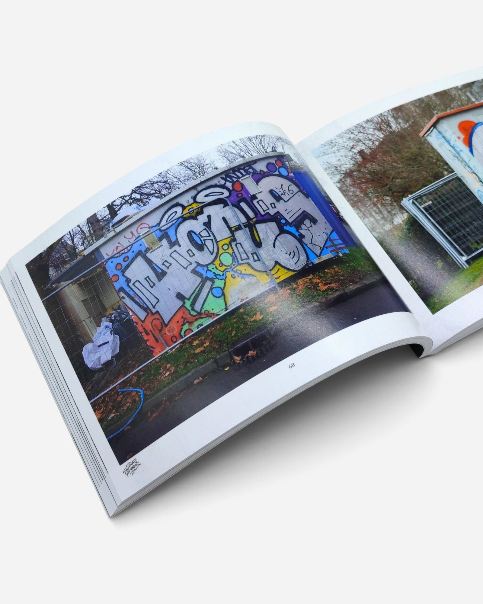 Astrofat Silver Fingers Vol.3 photography book open to a page showing colorful graffiti art in Rennes, France.