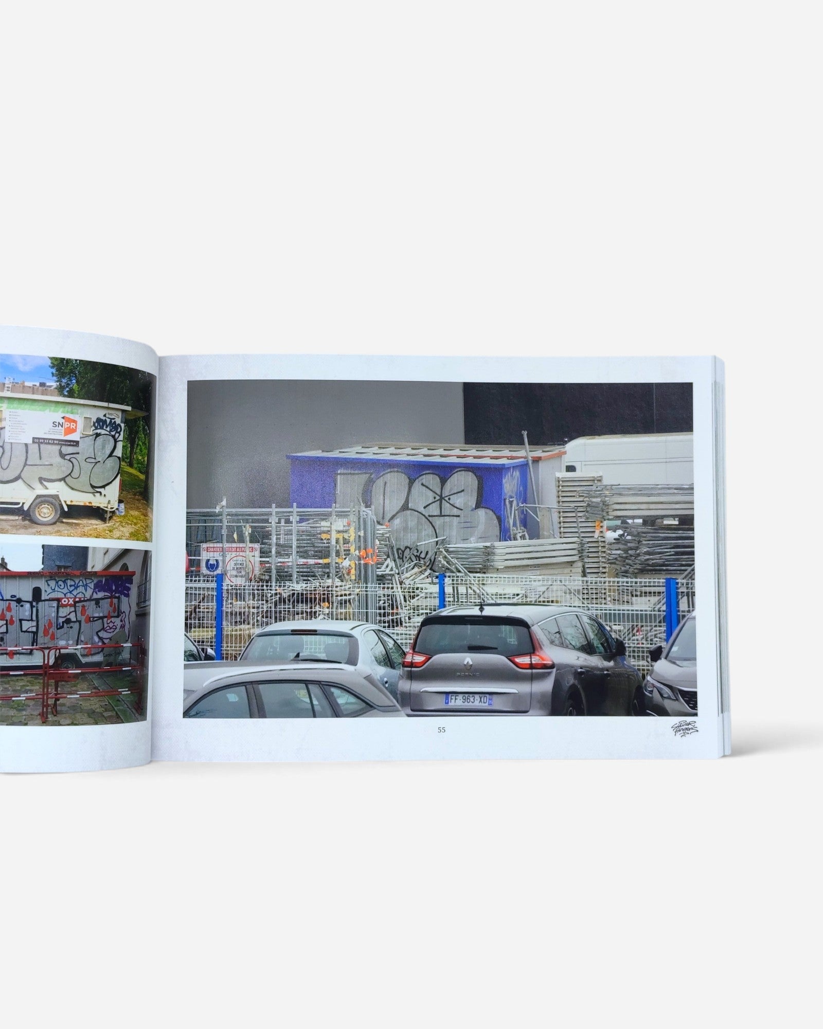 Astrofat Silver Fingers Vol.3 photography book open to a page showing graffiti art on a container in Rennes