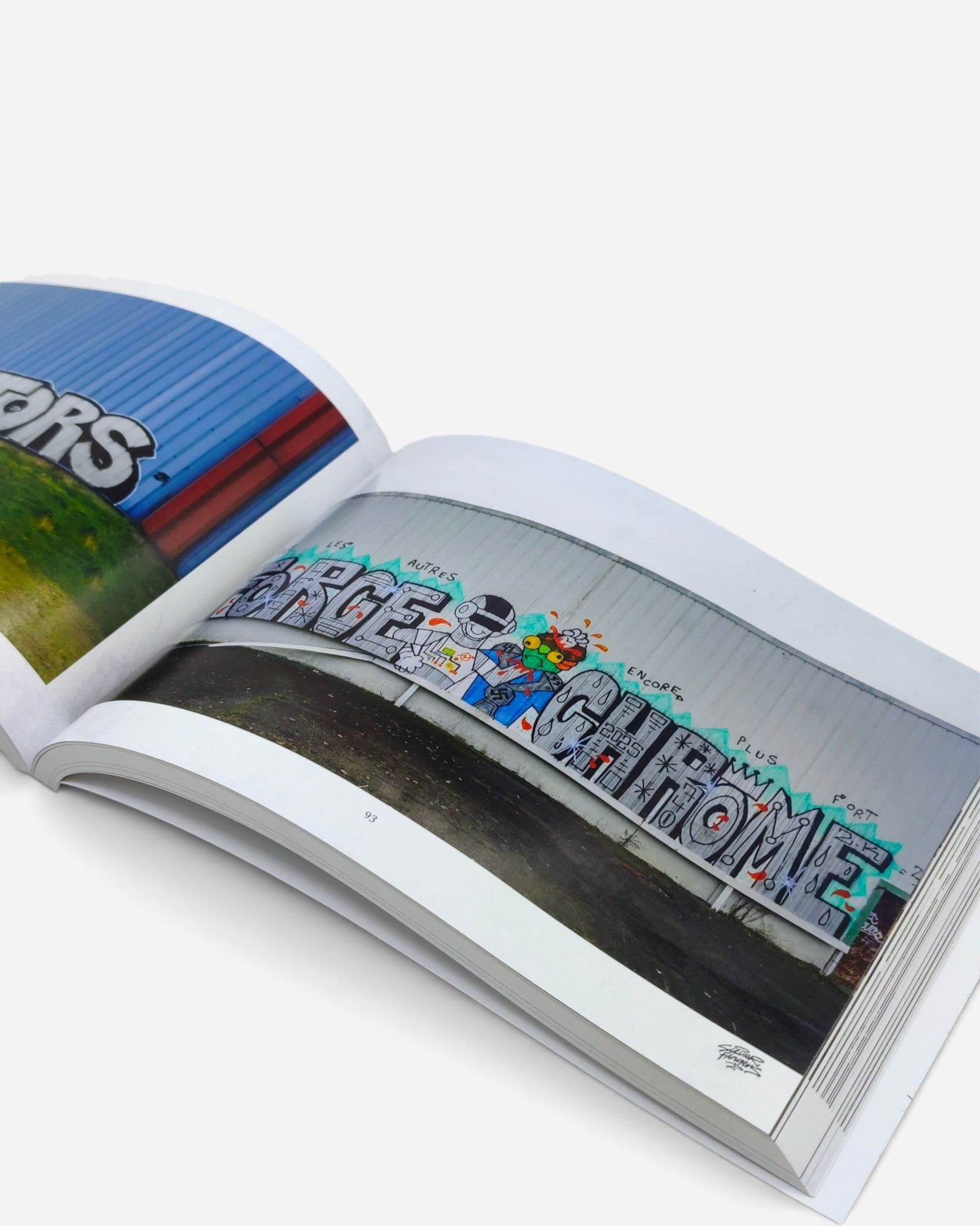 Astrofat Silver Fingers Vol.3 graffiti photography book open to a page showing colourful street art in Rennes