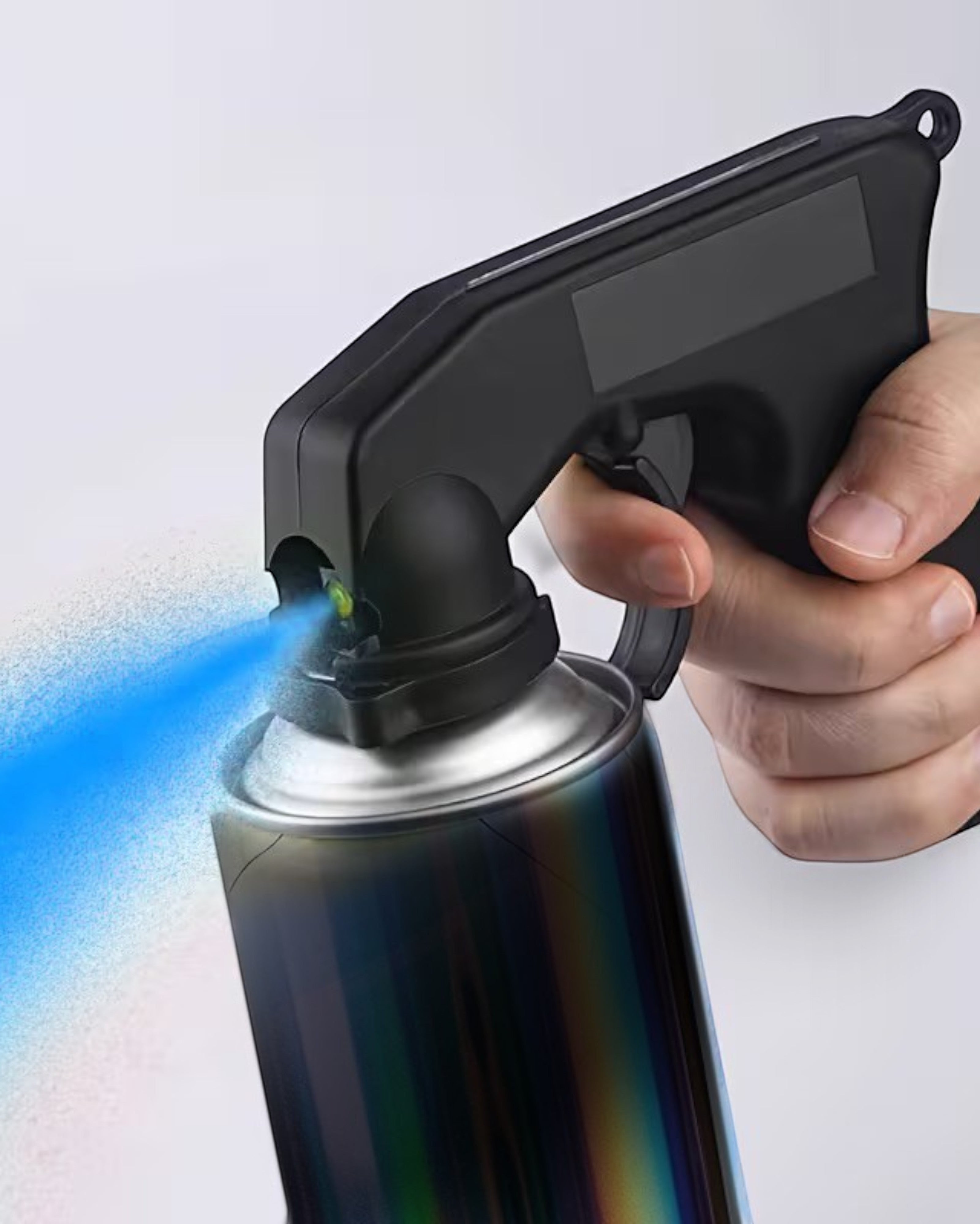 Astrofat black spray gun adapter attached to a spray paint can, held by a hand for comfortable large-scale painting.