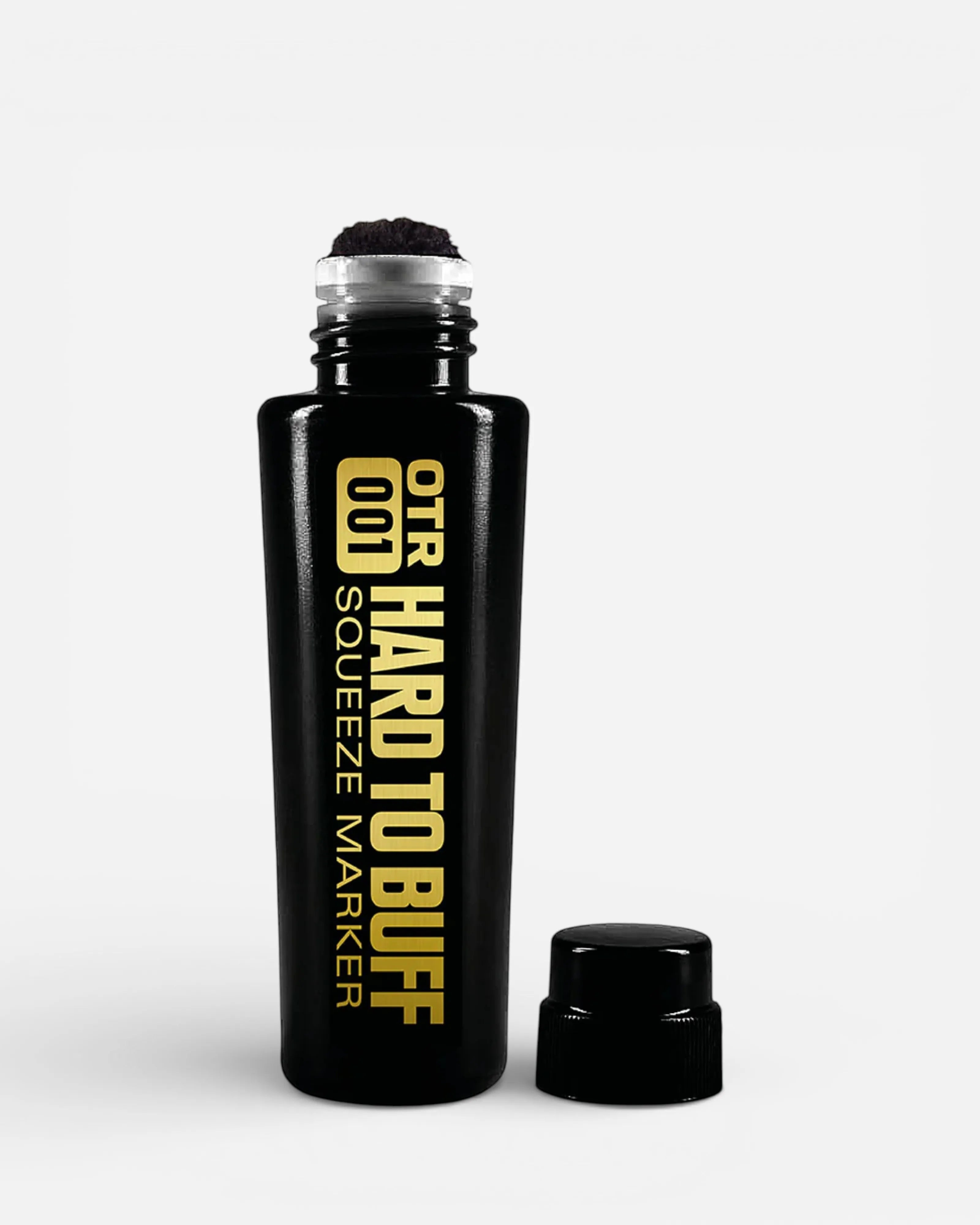 Astrofat OTR.001 Hard To Buff Squeeze Marker 22mm black bottle with gold lettering and a black cap.