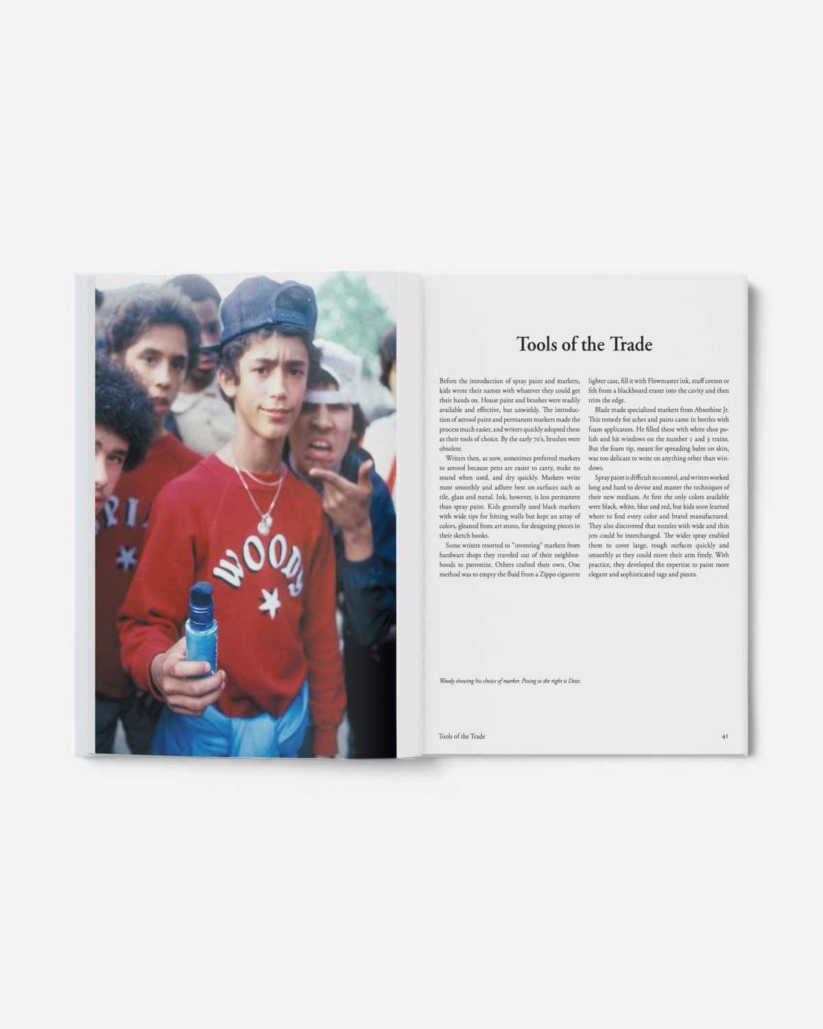 Astrofat Tag Town book open to a page showing Martha Cooper photography of young graffiti writers and tools of the trade