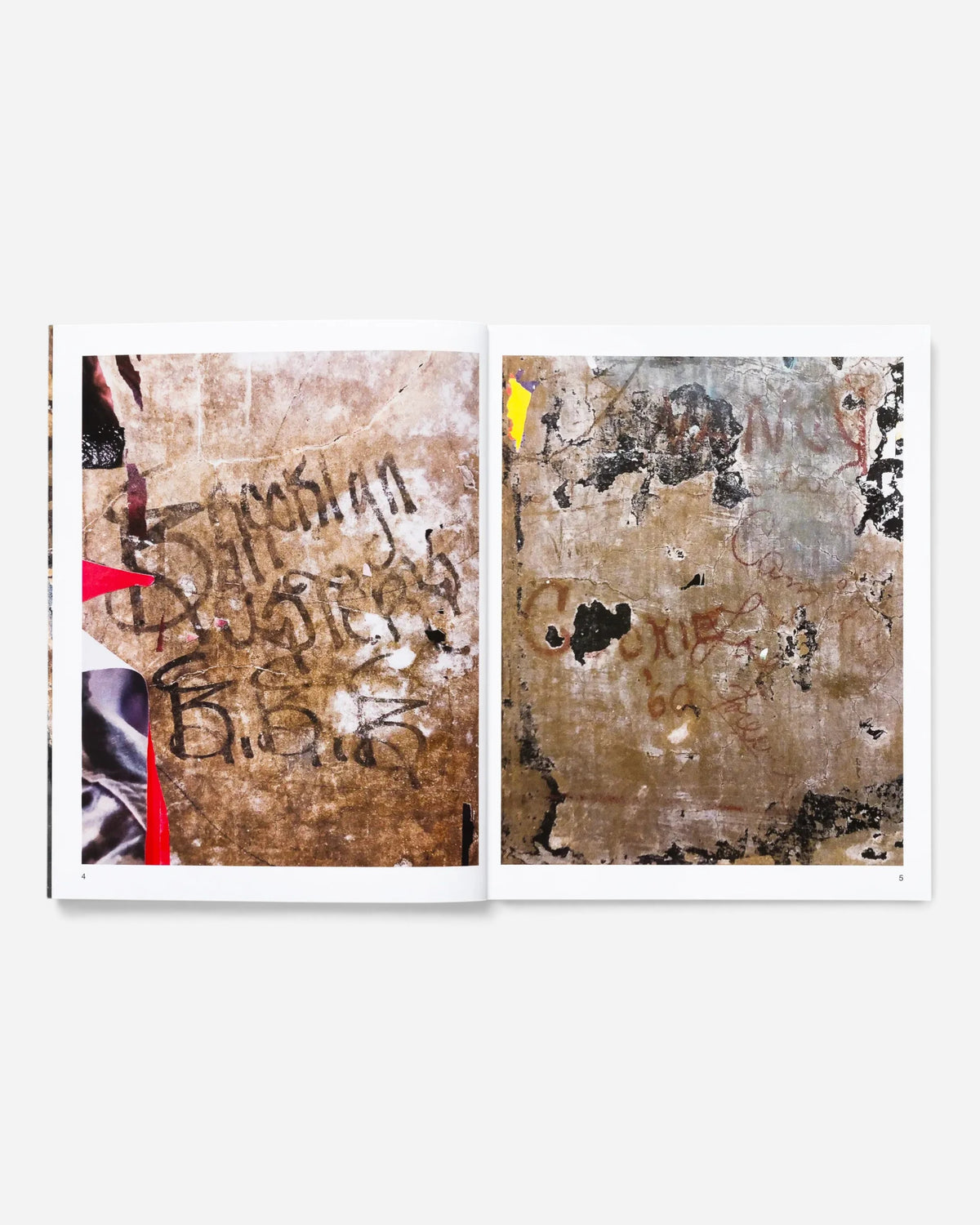 Astrofat Tag Town book open to pages showing vintage New York City graffiti tags and street art photography