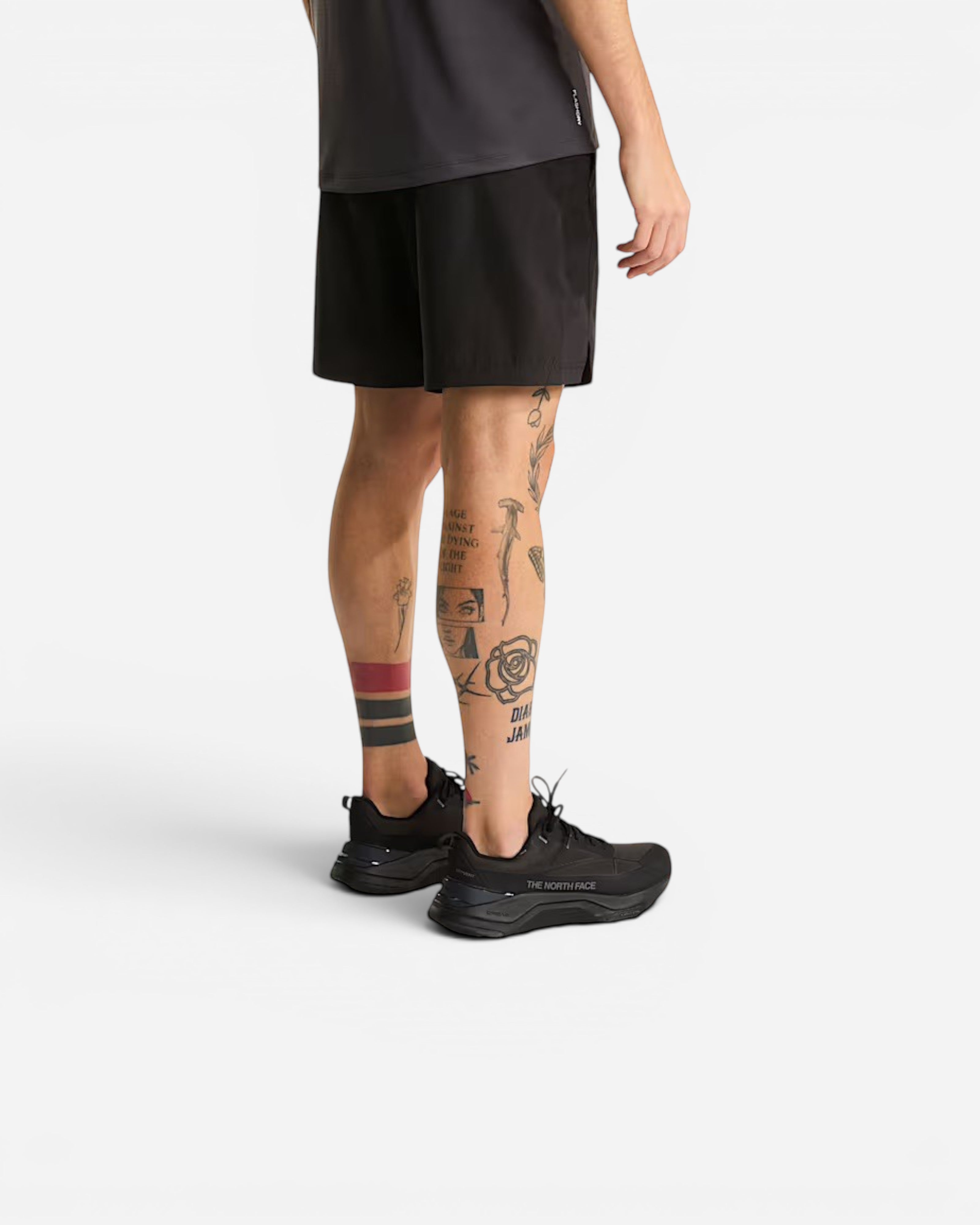 Astrofat The North Face black athletic shorts with FlashDry moisture-wicking fabric and zippered pocket, back view.