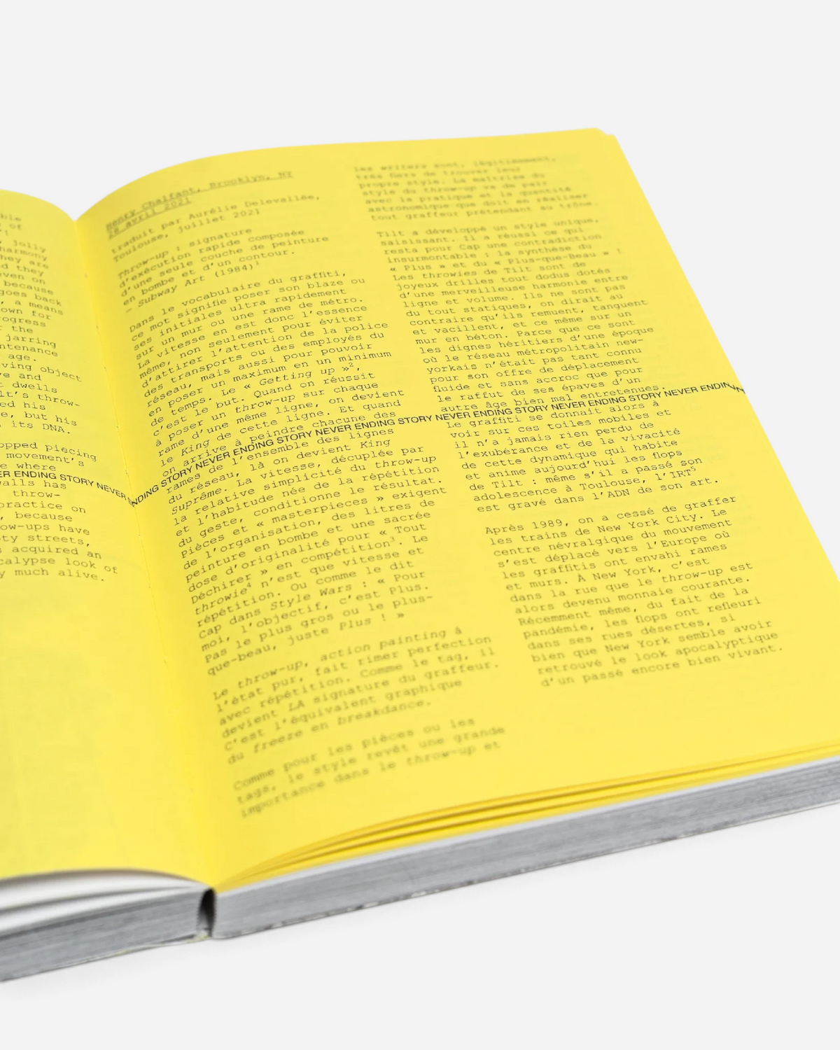 Astrofat Tilt Never Ending Story book open to a page with French text and a yellow highlighted section