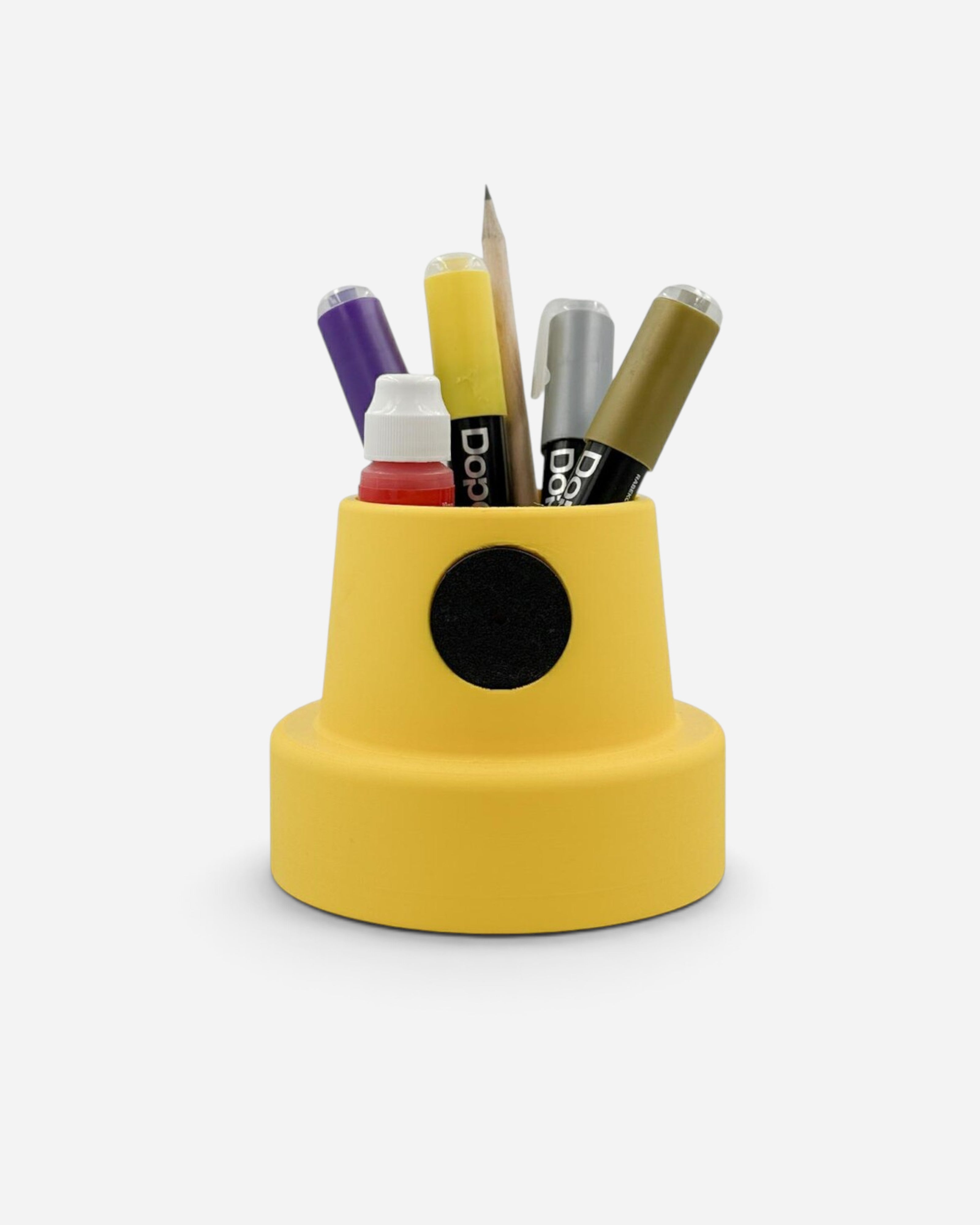 Astrofat yellow cap-shaped desk organizer made of PLA, holding various pens and markers on a white background.