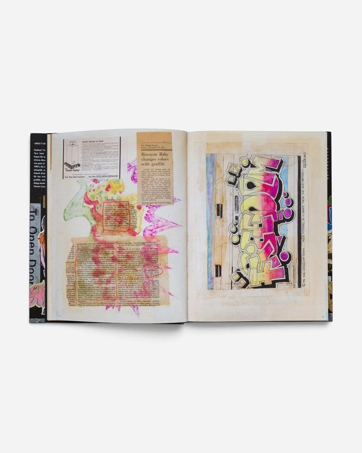 Astrofat Zephyr Graffiti Black Book open to a page featuring a vibrant Freedom graffiti tag and vintage newspaper clippings.